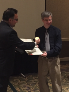 Dr. Kent Price (right) receiving the Pelgram Award.
